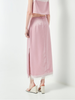 Chân váy dài màu hồng xẻ tà có viền ren